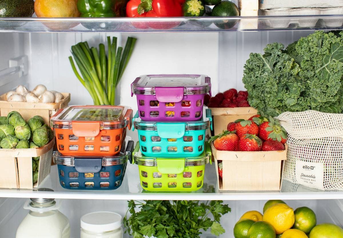 A person choosing vegetables and lean protein at a grocery store, illustrating weight loss tips healthy choices